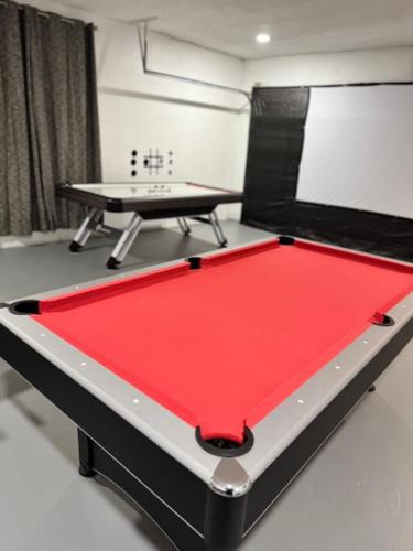 a pool table in a room with a ping pong table at Relax in Lakeland Home, Swim, Pool, Arcade LegoLand, Disney, Bush Garden in Lakeland