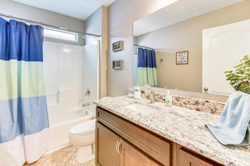a bathroom with a sink and a toilet at Outdoor Entertaining Space Family Home in Milton in Milton