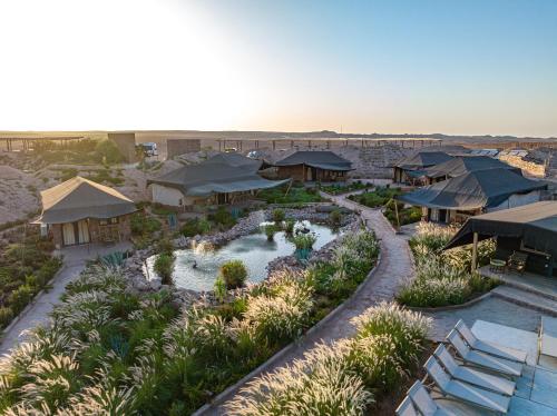 an aerial view of a resort with a pool at Le Bédouin agafay in Marrakech