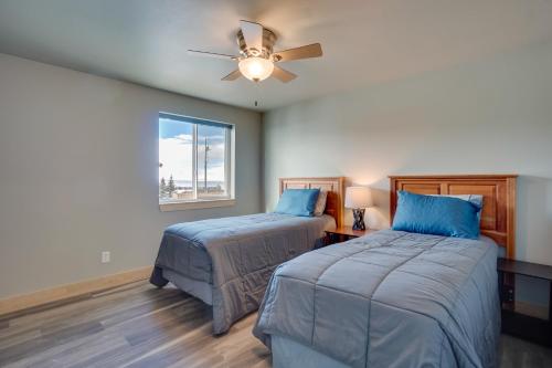 a bedroom with two beds and a ceiling fan at Saratoga Retreat about 3 Mi to Saratoga Lake! in Saratoga