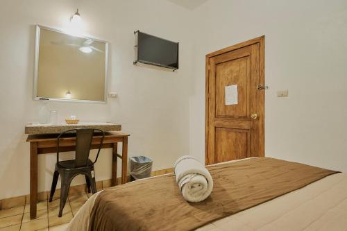 TV a/nebo společenská místnost v ubytování Hotel Cervantino