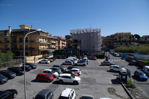 a parking lot filled with lots of parked cars at Magnolia House in Fonte Nuova