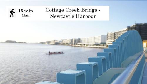 a boat in the water next to some buildings at Newcastle Penthouse - Sleeps 10 in Wickham