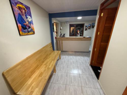 a hallway with a wooden bench in a room at Andenes del Inca Hotel in Ollantaytambo