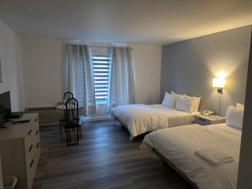 Katil atau katil-katil dalam bilik di Hôtel Saint-Côme