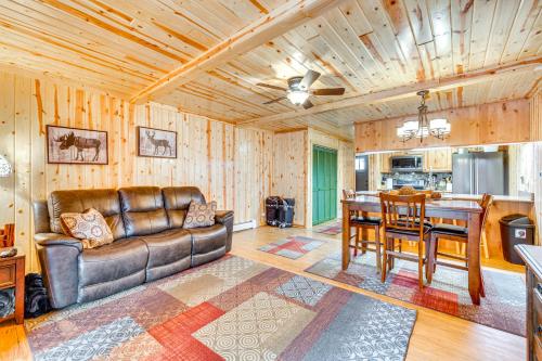 a living room with a couch and a table at 1 Mi to Rocky Mtn Natl Park Estes Park Townhome in Estes Park