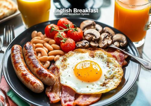 a plate of breakfast food with eggs sausage and mushrooms at Igloo Magnolia Room Stay I Breakfast I Free Parking in Leeds