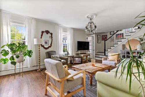 a living room with a couch and a table at Historic Downtown Berlin Home Dog Friendly Home in Berlin