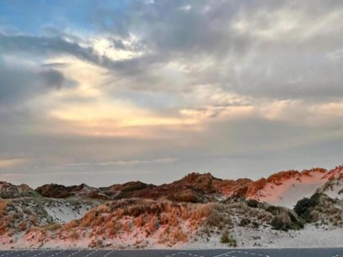 a view of a snowy mountains with a cloudy sky at Apartment in Quend near the Sea in Quend