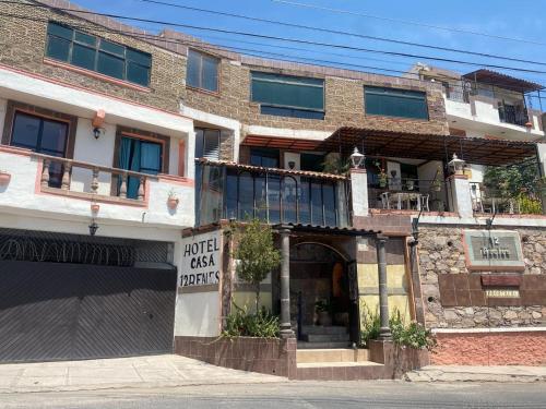 a building with a sign that reads hotel cash orders at Casa 12 Reales in Guanajuato