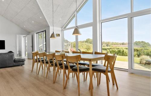 a dining room with a table and chairs at Gorgeous Home In Sjølund With Kitchen in Sjølund