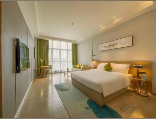 Starway Hotel Luogang Wanda Plaza房間的床