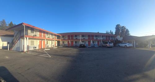 a large parking lot in front of a building at National 9 Motel in Santa Cruz