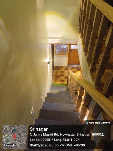 a stairway in a building with a stair case at Winter Wonder Home Stay in Srinagar
