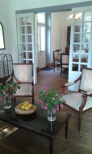 a living room filled with furniture and a table at La Sauldre in Vailly-sur-Sauldre