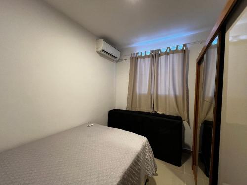 Katil atau katil-katil dalam bilik di Condomínio Reserva Almagre