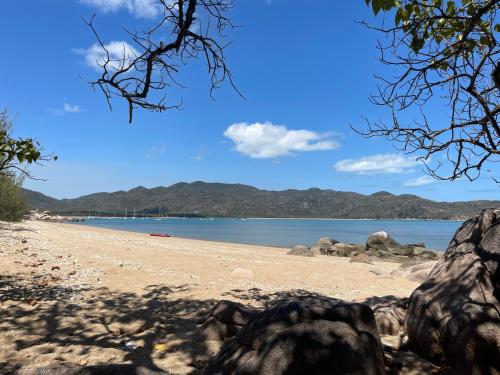 a view of a beach with mountains in the background at Windspray in Horseshoe Bay