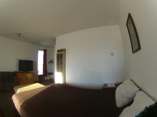 Postel nebo postele na pokoji v ubytování Rycroft Hotel