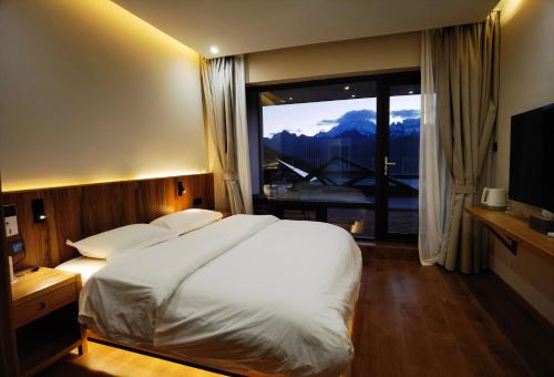Katil atau katil-katil dalam bilik di Wake Up In Snow Capped Peaks