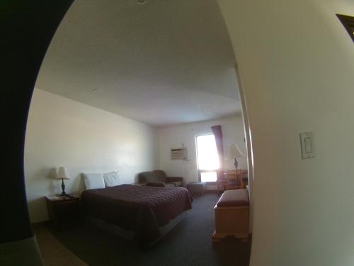 Postel nebo postele na pokoji v ubytování Rycroft Hotel