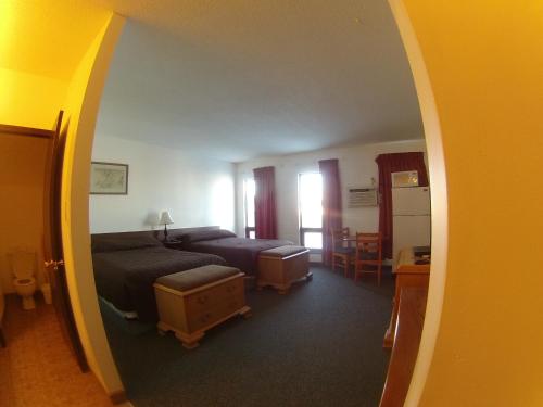 Postel nebo postele na pokoji v ubytování Rycroft Hotel