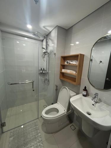a bathroom with a shower and a toilet and a sink at New Condo at Cebu City in Cebu City