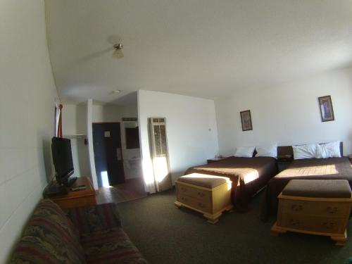 Postel nebo postele na pokoji v ubytování Rycroft Hotel