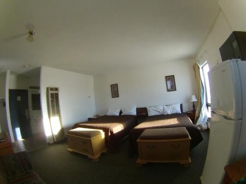 Postel nebo postele na pokoji v ubytování Rycroft Hotel