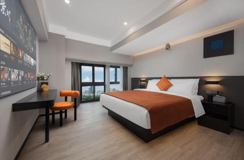 Cama o camas de una habitación en LlA Hotel Liang Jun Plaza, Xixiang Avenue