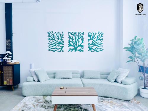a living room with a couch and a table at The Stallion #108 - Modern Spacious Loft in Downtown with free parking in Memphis