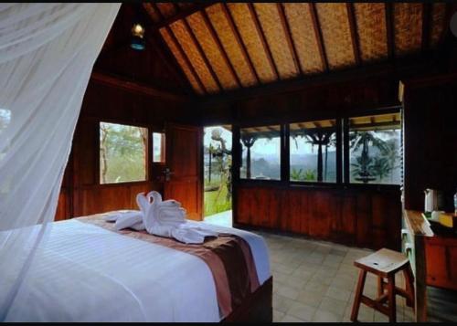 Кровать или кровати в номере Gladak di Uma Bali