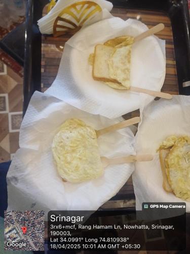 two pieces of bread on a tray with chop sticks at Winter Wonder Home Stay in Srinagar