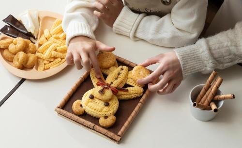 a tray of cookies and chips on a table at Shilla Stay Cheonan Asan - Samsung Display City in Cheonan