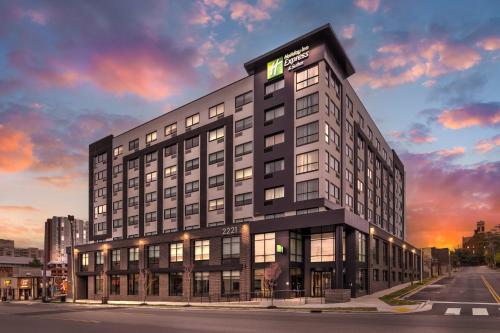 a rendering of a building with a sunset at Holiday Inn Express & Suites Nashville West End - Univ Area by IHG in Nashville