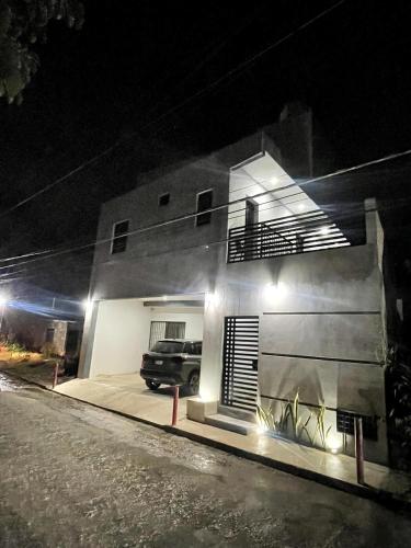 a truck parked in front of a house at night at Dina's apartment, a charming place with Tina in Valladolid