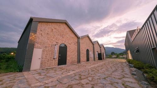 an old brick church with a cobblestone street at Le Pavilion Pool Villa in Pohang