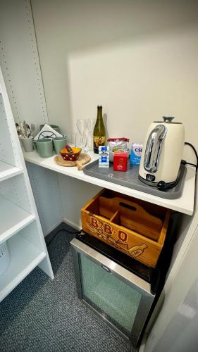 a kitchen counter with a toaster on a shelf at Romantic Getaway - Private Guest Suite - Country setting amongst Orange's best Wineries in Orange