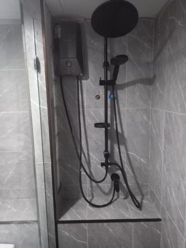 a shower in the corner of a bathroom at Hua Hin - My pleasure in Hua Hin