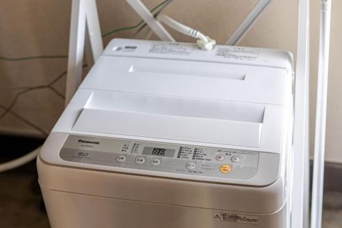 a fax machine sitting next to a wall at Magic hour nasu Tochigi BBQ available in Nasu-yumoto