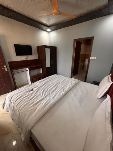 Katil atau katil-katil dalam bilik di Dharohar Homestay Chandrabhaga