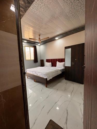 Katil atau katil-katil dalam bilik di Dharohar Homestay Chandrabhaga
