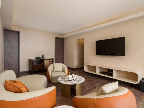a large living room with a flat screen tv at Daybreak in Jiufen