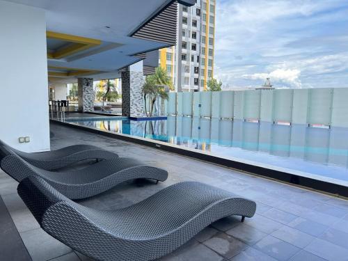 a row of chairs sitting on top of a building at G Home 3 - Ipoh City Centre Majestic 2R2B in Ipoh