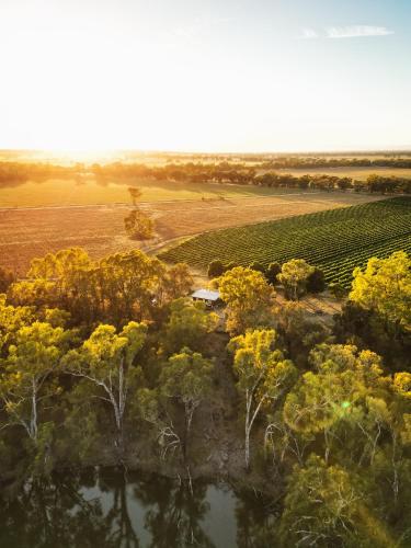 an aerial view of a field with trees and a pond at Moodemere Lake House in Rutherglen