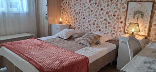 En eller flere senge i et værelse på Le clos fleuri
