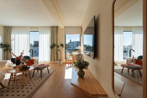 a living room with a large mirror on the wall at The White Courtyard in Dali