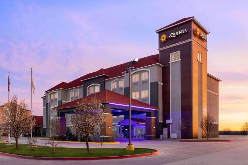 a building with a clock tower on top of it at La Quinta by Wyndham Dumas in Dumas
