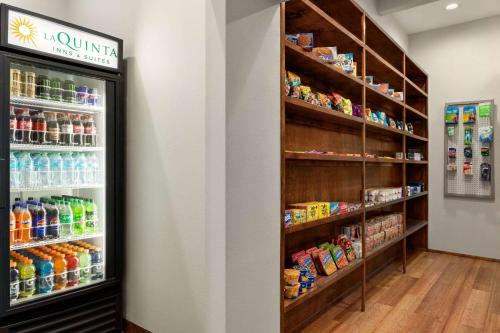 a store with a refrigerator filled with lots of drinks at La Quinta by Wyndham Dumas in Dumas