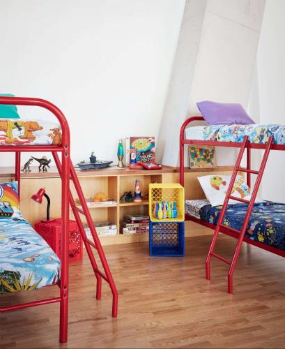 a room with two bunk beds and a desk at Graduate by Hilton New York in New York