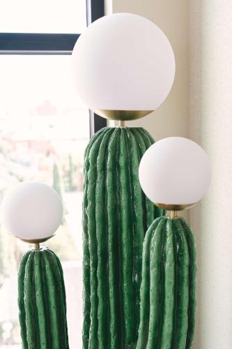 a pair of green cactus lamps on a wall at Graduate by Hilton Tucson in Tucson